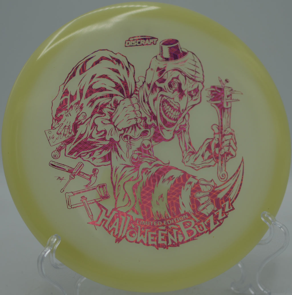 Discraft 2025 LE Halloween Mega Glo Buzzz single stamp parking an upshot at Shawshank Disc Golf Course in Huntsville, Texas.