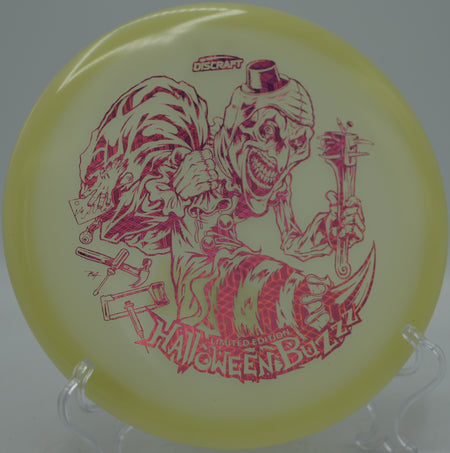 Discraft 2025 LE Halloween Mega Glo Buzzz single stamp parking an upshot at Shawshank Disc Golf Course in Huntsville, Texas.