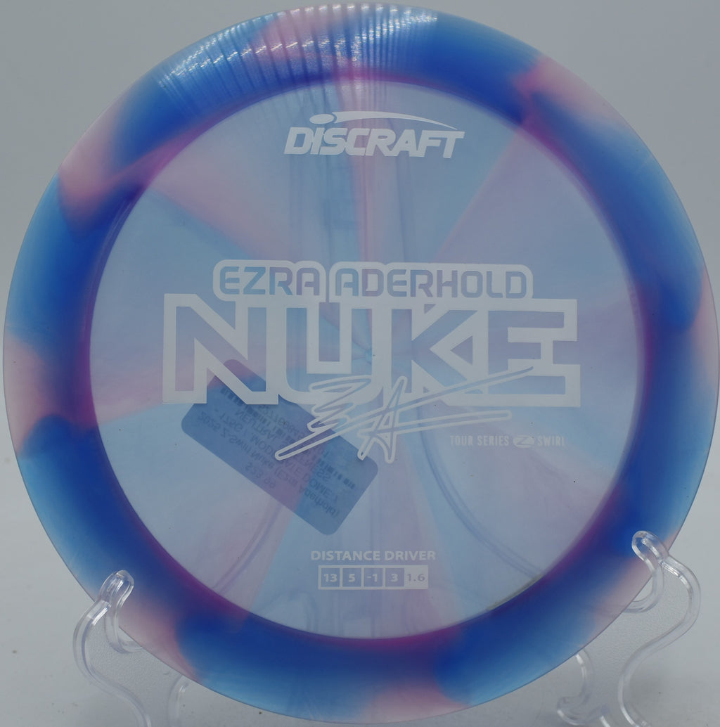 Z-Swirl Nuke 2025 Ezra Aderhold edition carving wide flex lines at Maple Hill Disc Golf Course in Leicester, Massachusetts.
