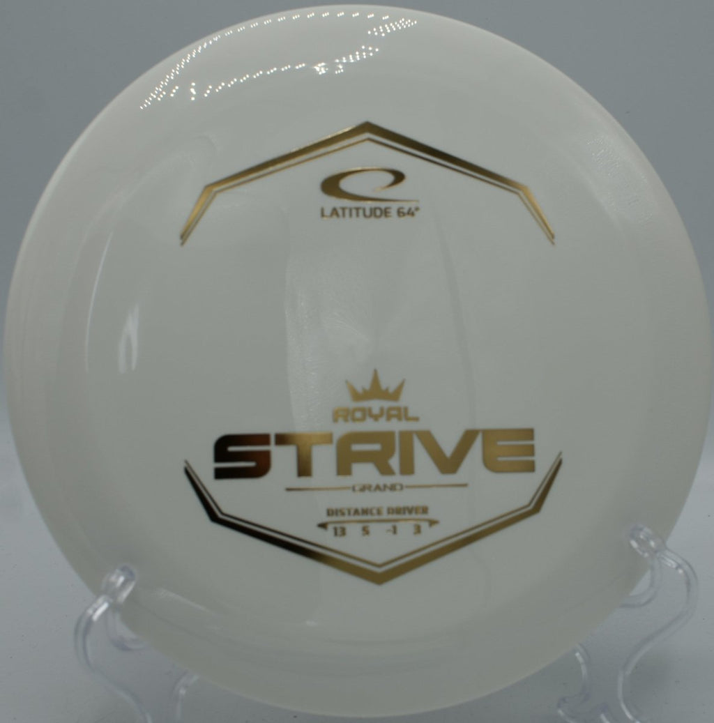 Royal Line Grand Strive distance driver placed beside tee sign at Trophy Club Disc Golf Course in Trophy Club, Texas