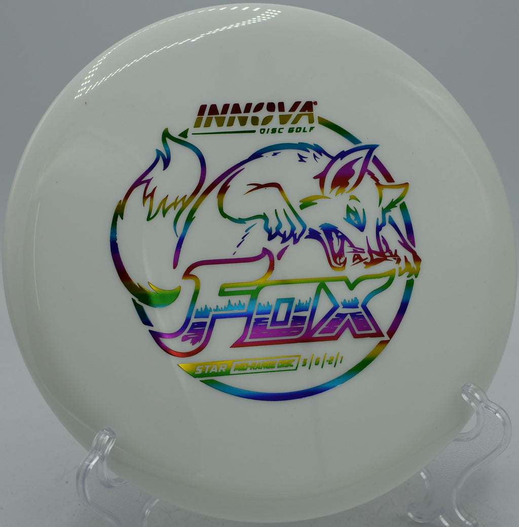 Innova Star Fox midrange disc floating down a wooded tunnel at DeLaveaga Disc Golf Course in Santa Cruz, California.