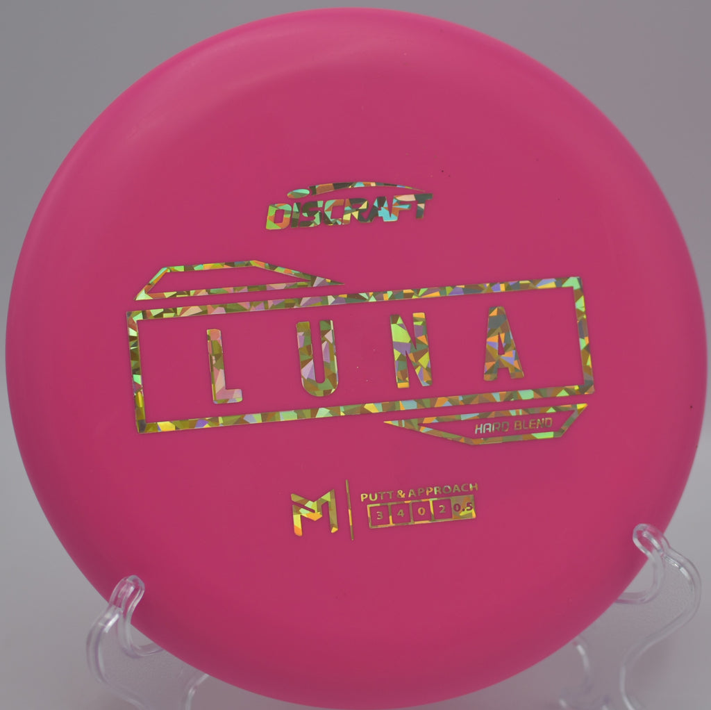 Hard Blend Luna flying straight through the forested fairway at Bryant Park Disc Golf Course in Albany, Oregon.