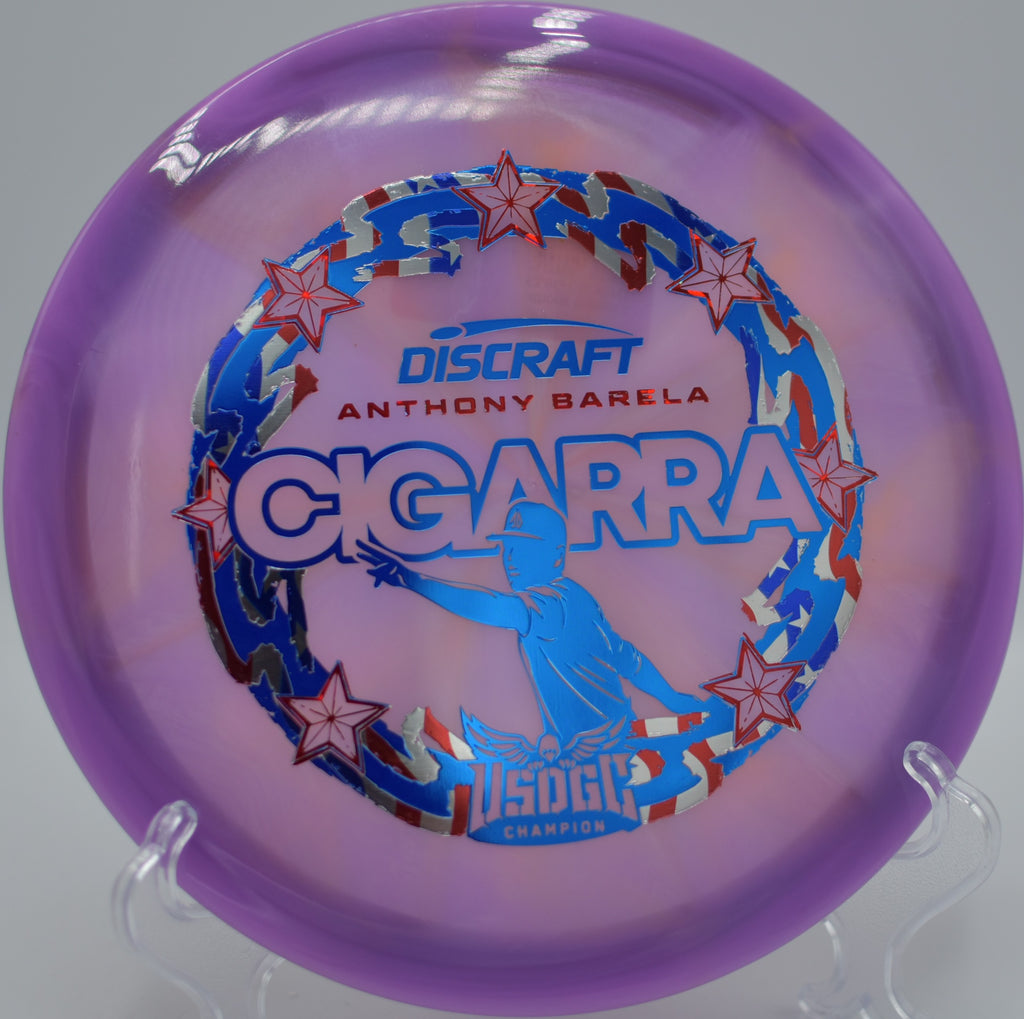 Discraft Cigarra in Z-Swirl plastic staged at Heritage Park DGC in Belton, KS, ideal for powered hyzer-flips and controlled turnovers.