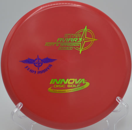 Innova Star Aviar3 (Team Stamp) launched on a flat, controlled approach toward the basket at DeLaveaga Disc Golf Course in Santa Cruz, California.