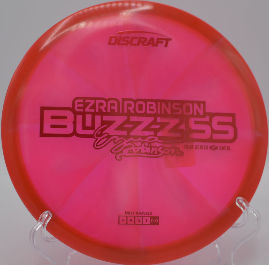 Discraft 2025 Ezra Robinson Z Swirl Buzzz SS holding a gentle turnover at Idlewild Disc Golf Course in Burlington, Kentucky.