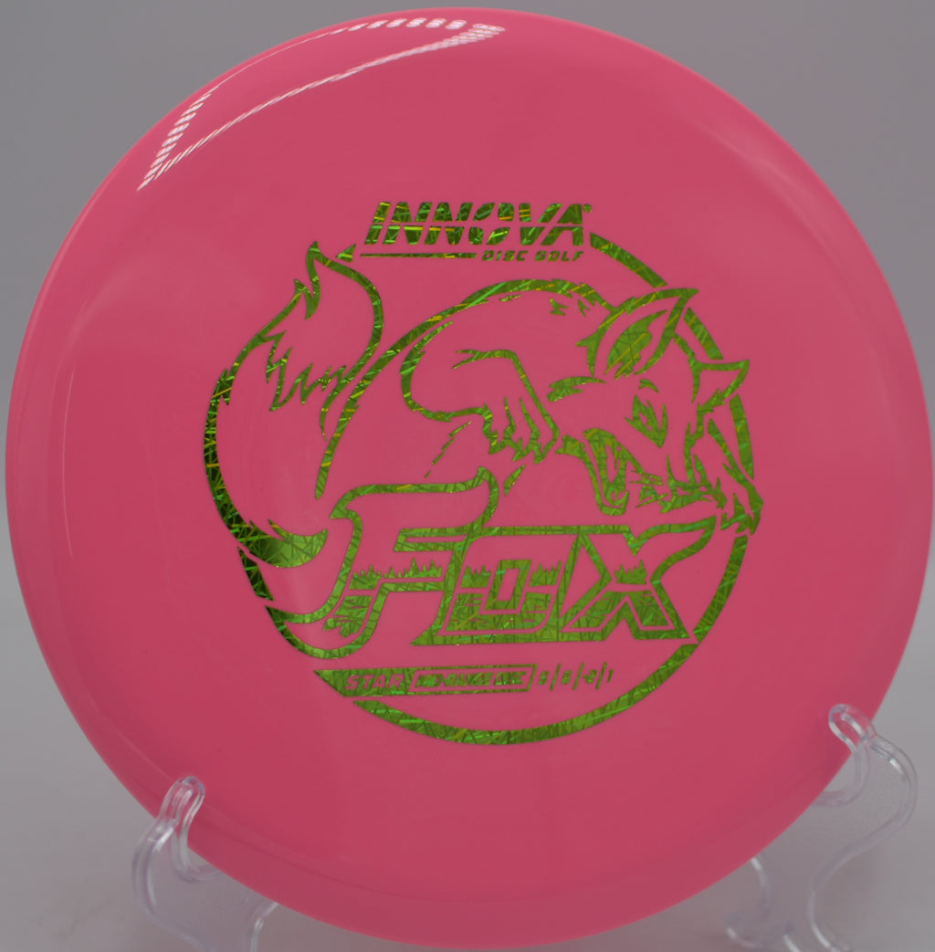 Durable Star Fox fairway driver resting near the pin after a straight drive at Waterworks Park Disc Golf Course in Kansas City, Missouri.