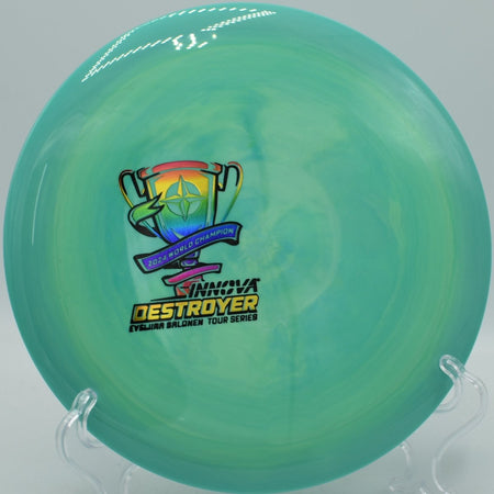 Ohn Scoggins Glow Halo Destroyer distance driver displayed at Eagles Crossing Disc Golf Course in Hawk Point, Missouri, perfect for powerful flex shots and tournament play