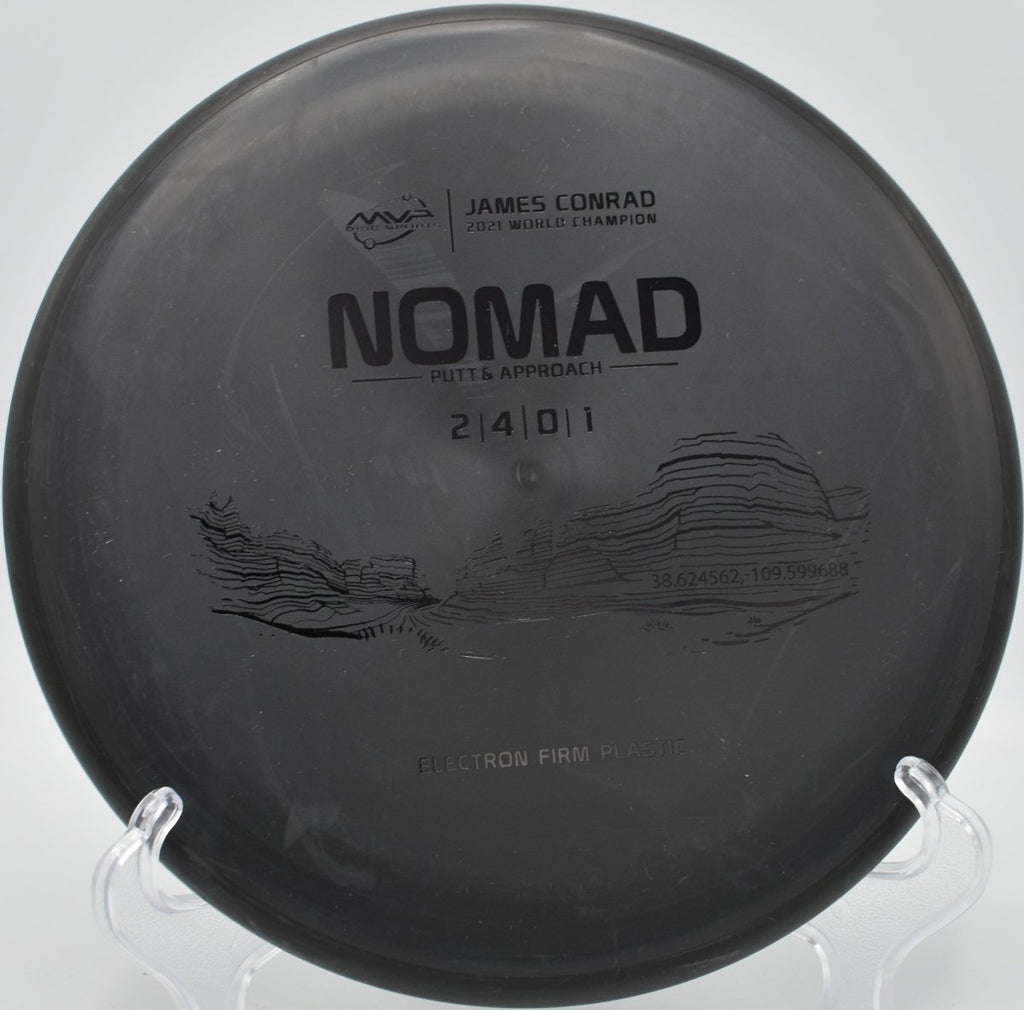 MVP Electron Firm Nomad putter parked on the putting surface after a soft landing upshot at Columbia Park Disc Golf Course in Kennewick, Washington