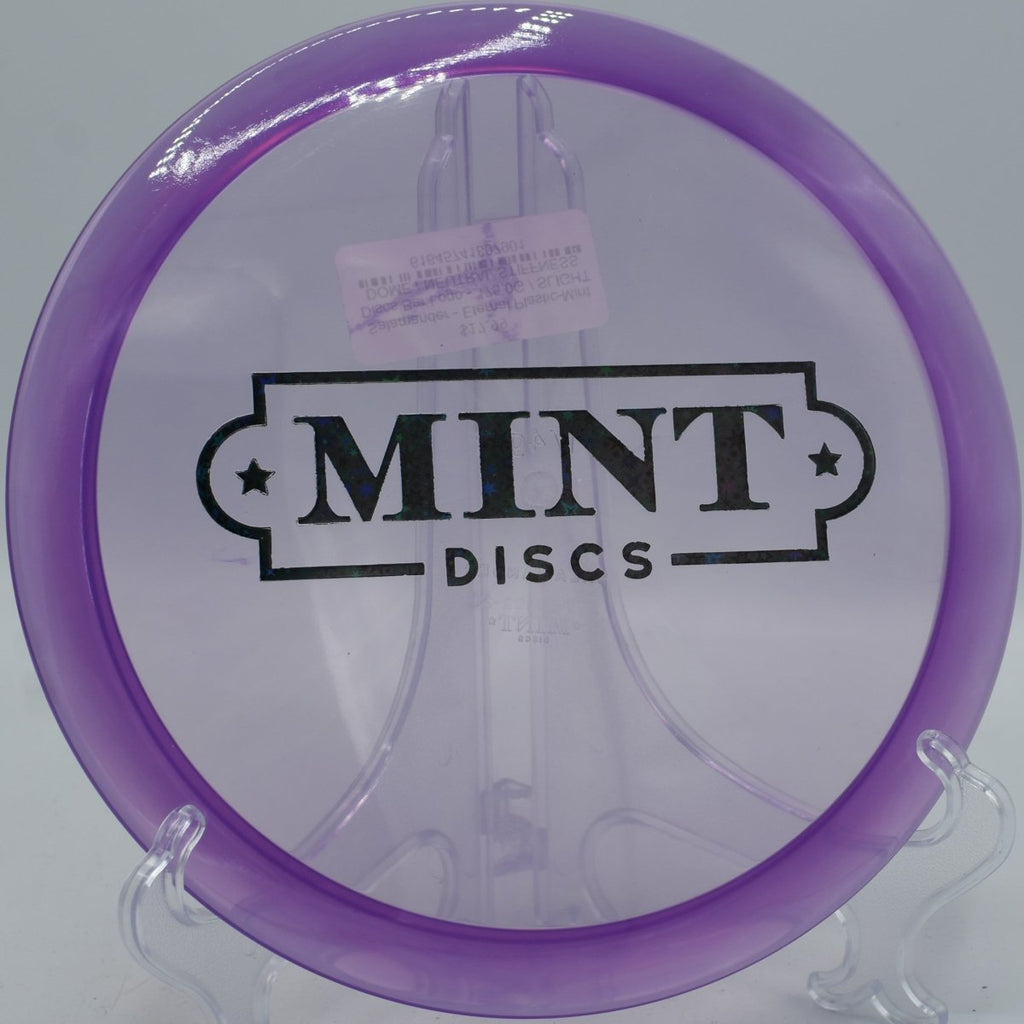 Mint Discs Eternal Salamander fairway driver gliding forward on wooded hole at Harmon Hills Disc Golf Course in Fall Branch Tennessee