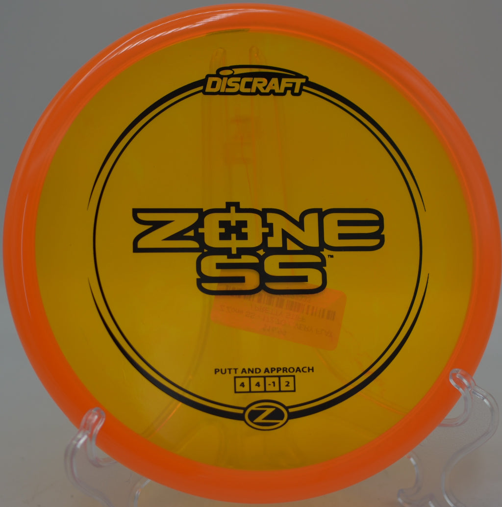 Discraft Z Zone SS settling softly inside circle one at Jones East Disc Golf Course in Emporia, Kansas.