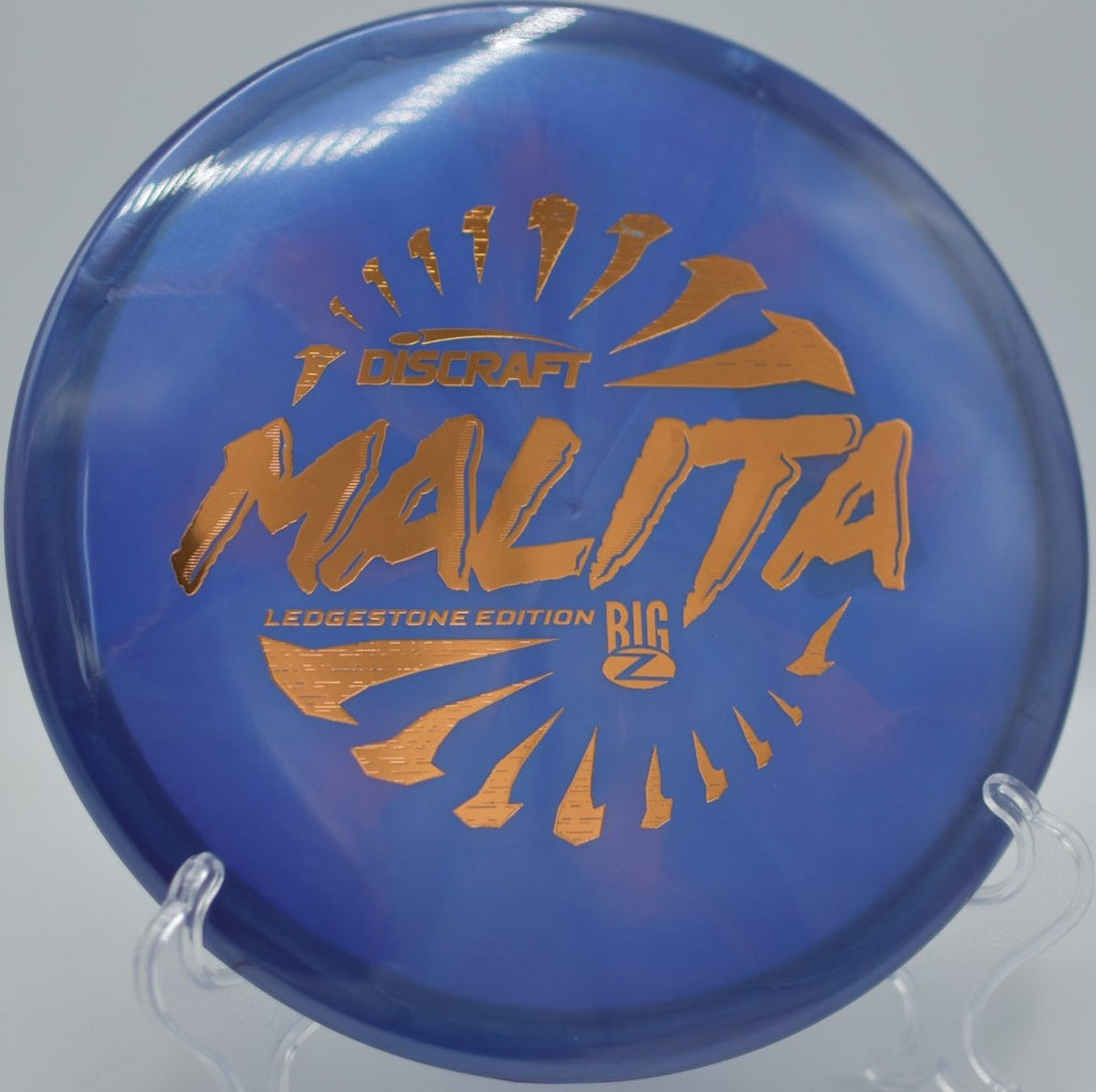 Discraft Malita Big Z Swirl midrange finishing softly on a technical fairway at Winthrop Gold Disc Golf Course in Rock Hill, South Carolina