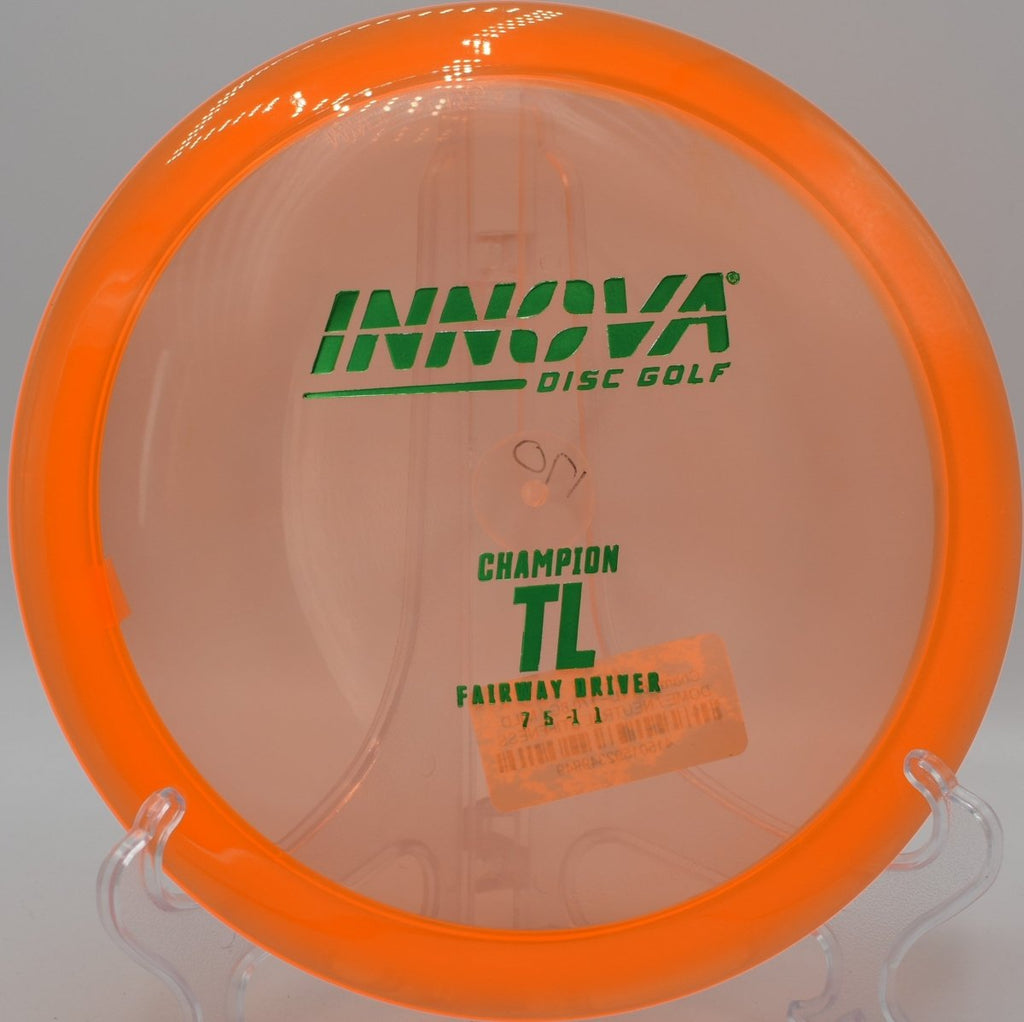 Innova Champion TL driver executing a precision fairway drive with minimal fade at Camp Jordan Disc Golf Course in East Ridge, Tennessee