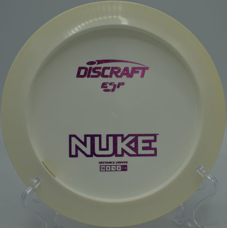 Discraft ESP Nuke launched on a massive distance drive at Maple Hill Disc Golf Course in Leicester, Massachusetts.