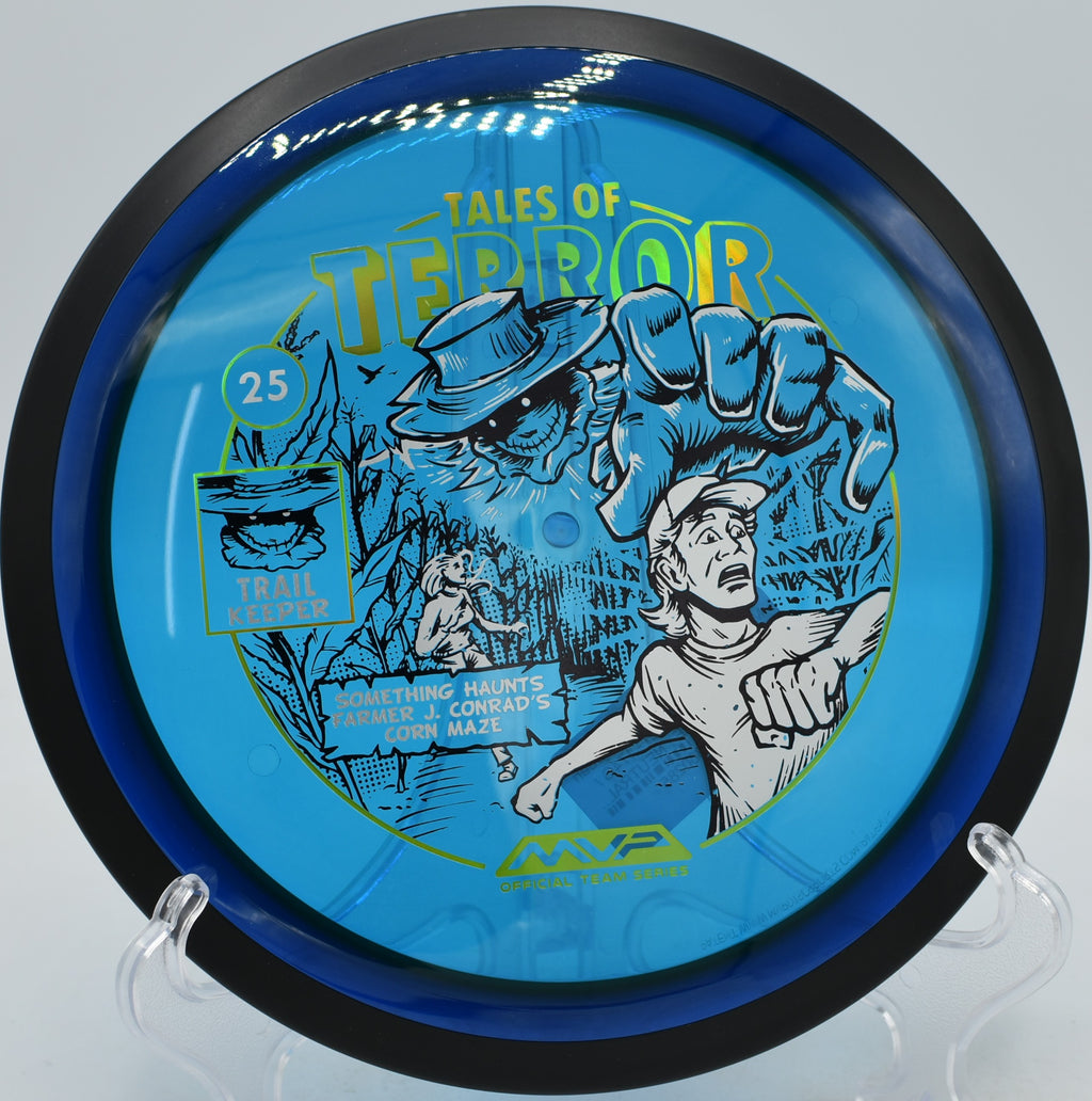Special Edition Halloween Trail by MVP sailing down a wooded corridor at Trophy Club Disc Golf Course in Texas, showing off its neutral-stable flight path.