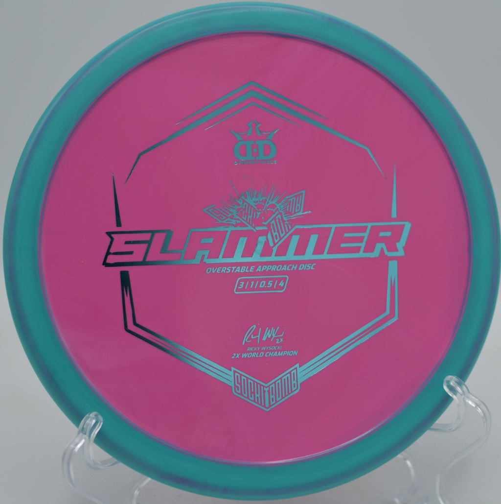 Sockibomb Slammer landing softly beside the basket at North Cove Disc Golf Course in Marion, North Carolina.