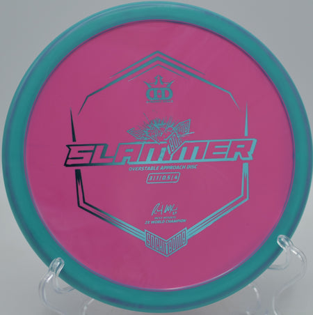 Sockibomb Slammer landing softly beside the basket at North Cove Disc Golf Course in Marion, North Carolina.