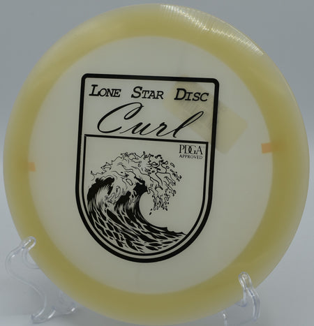 "Lone Star Curl disc flying over the scenic fairway at Fort Steilacoom Disc Golf Course in Lakewood, Washington, showcasing its reliable stability."
