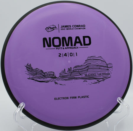 Electron Firm Nomad disc golf putter beside the cage after a straight approach shot at Roosevelt Park Disc Golf Course in Rapid City, South Dakota