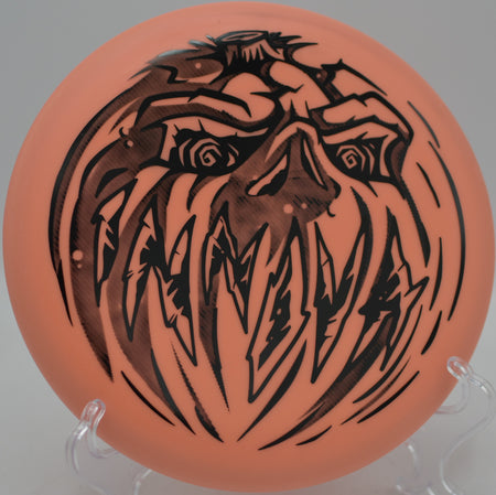 Halloween Nexus Proto Glow Aviar glowing on a basket run at North Cove Disc Golf Course in Marion, North Carolina.