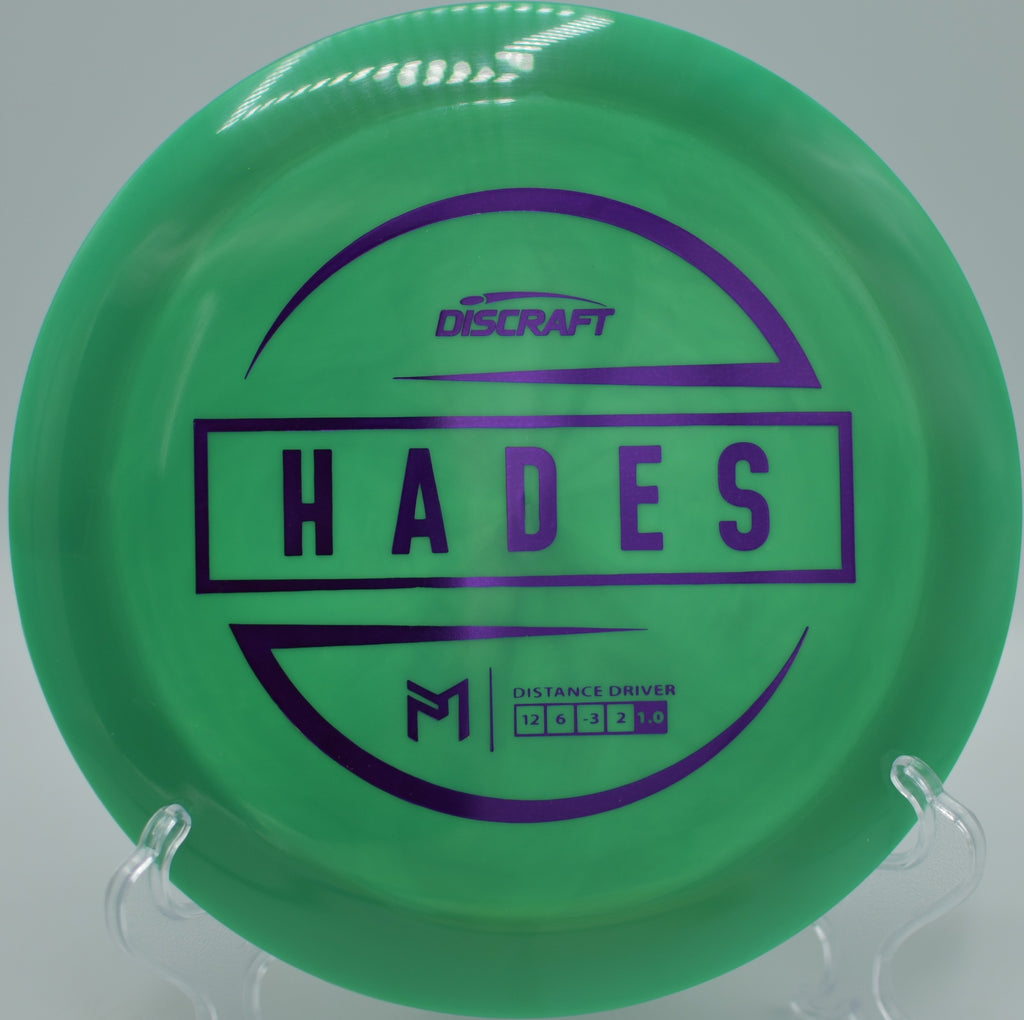 Discraft ESP Hades gliding through desert air with perfect turnover at Sunset Park Disc Golf Course in Las Vegas, Nevada.