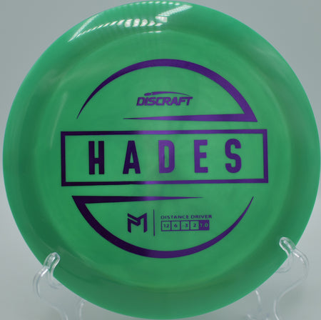 Discraft ESP Hades gliding through desert air with perfect turnover at Sunset Park Disc Golf Course in Las Vegas, Nevada.