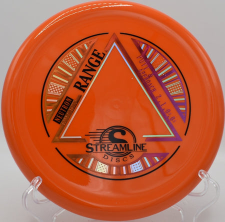 MVP Neutron Soft Range approach disc resting near chains on the green at Freedom Park Disc Golf Course in Williamsburg, Virginia