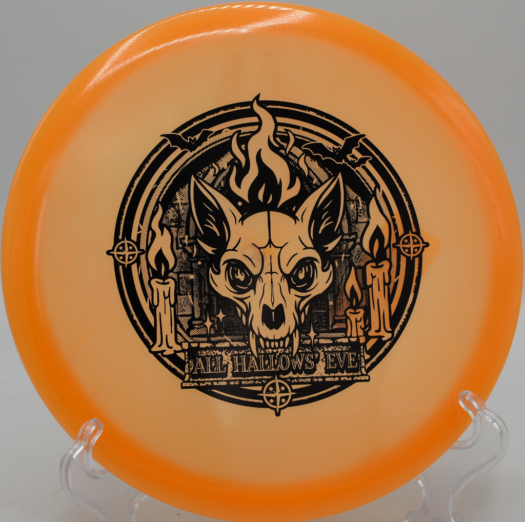 Innova Proto Glow Champion Fox disc gliding down a wooded fairway at Brewster Ridge Disc Golf Course in Smugglers’ Notch, Vermont