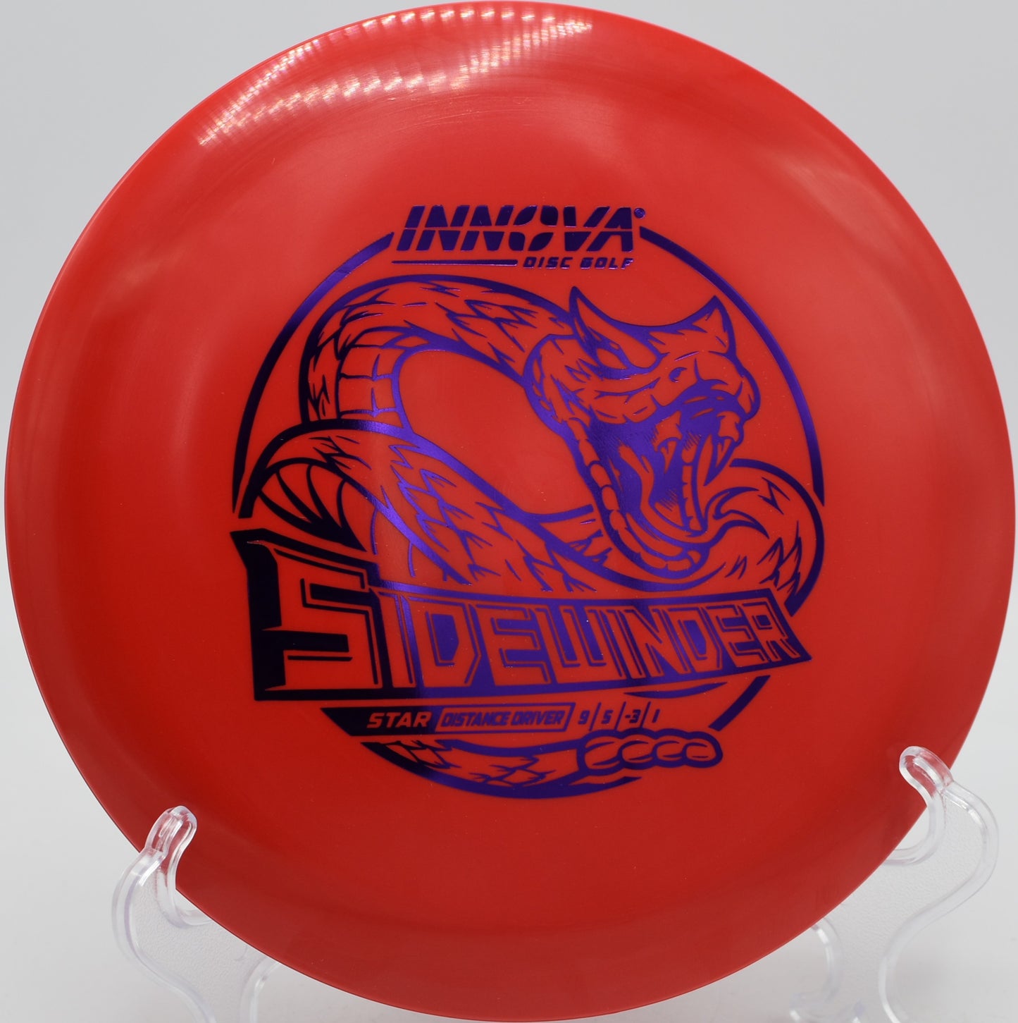 Lightweight Star Sidewinder hyzer-flipping out of the hand at Flip City Disc Golf Park in Shelby, Michigan
