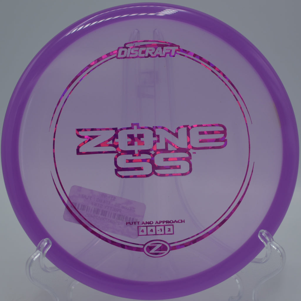 Discraft Z Zone SS skimming across short grass on a soft landing at Stafford Lake Disc Golf Course in Novato, California.