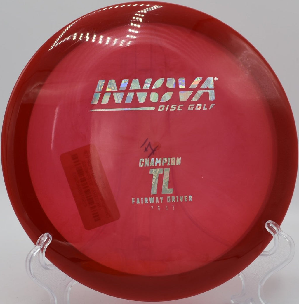 Champion TL fairway driver holding a clean hyzer flip line through wooded fairway at Green Valley Park Disc Golf Course in Payson, Arizona