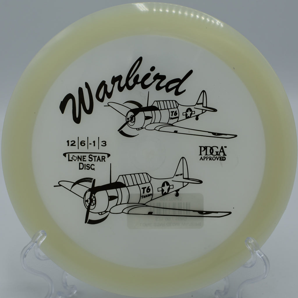 "Glow Warbird disc landing perfectly on target in Minneapolis, Minnesota, ideal for long, powerful hyzer throws."

