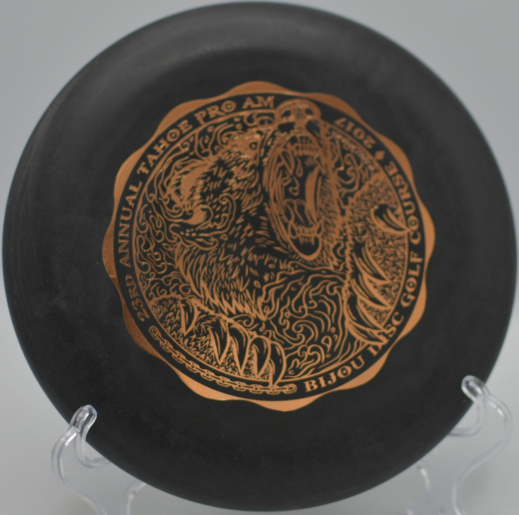 Black DX Aviar in mid-flight under desert skies at Fountain Hills Disc Golf Course in Fountain Hills, Arizona.