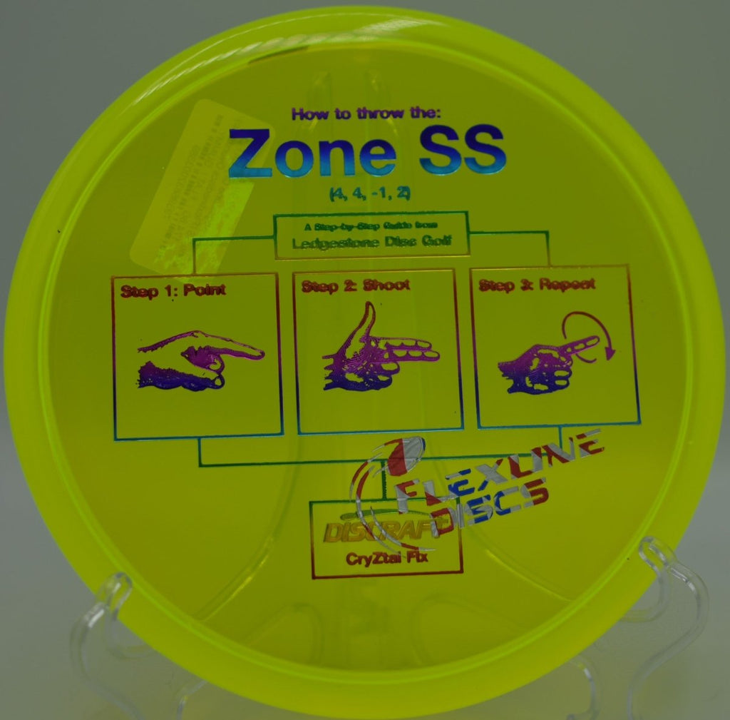 Zone SS CryZtal FLX putter landing flat near the pin at Caliber Disc Golf Course in Sandpoint, Idaho