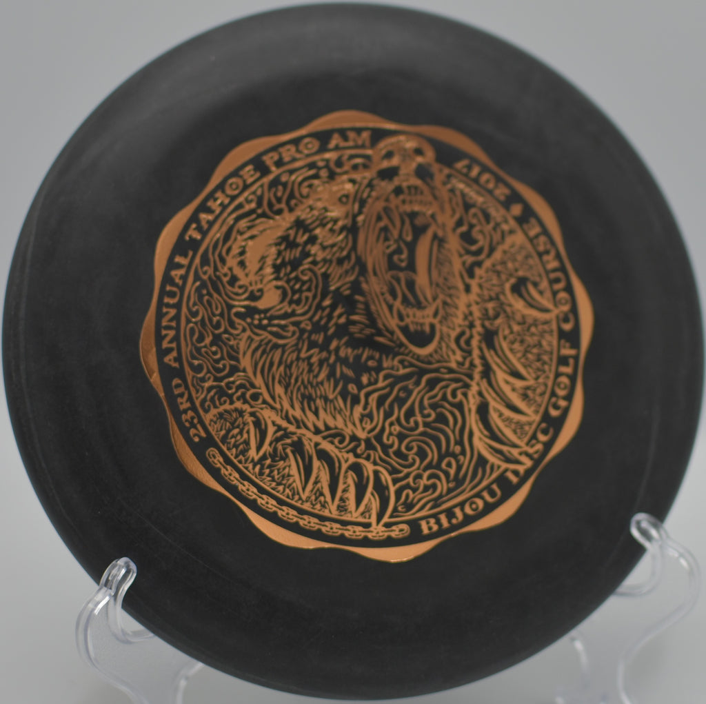 Black DX Aviar sinking into chains during a windy round at Waterworks Park Disc Golf Course in Kansas City, Missouri.