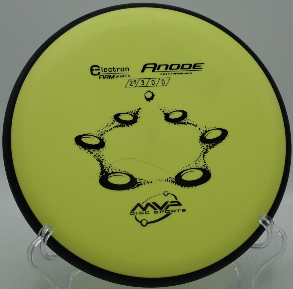 Electron Firm Anode disc golf putter resting on the putting green beside the cage at Lakeview Park Disc Golf Course in Sarasota, Florida