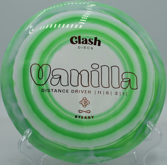 Steady Vanilla flying on a buttery hyzer-flip, turning slightly before fading cleanly at Maple Hill Disc Golf Course.

