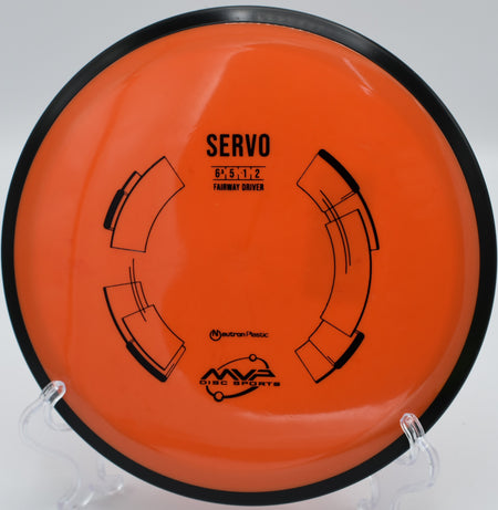 MVP Neutron Servo gliding down a wooded fairway at Maple Hill Disc Golf Course in Leicester, Massachusetts, ideal for straight control and low-speed finesse.

