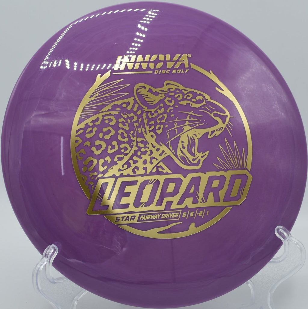 Innova Star Leopard driver gliding through wooded gap on a clean release at Hidden Ridge Disc Golf Course in West Milford, New Jersey