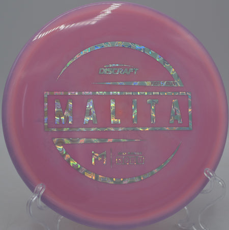 Discraft First Run Malita flying flat and clean through the woods at Morley Field Disc Golf Course in San Diego, California.