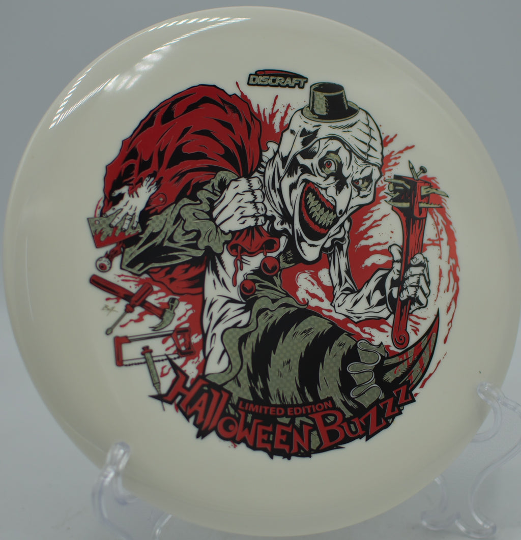 Discraft 2025 Halloween Glo Triple Stamped Buzzz carving a wooded fairway at Renny Gold Disc Golf Course in Charlotte, North Carolina.