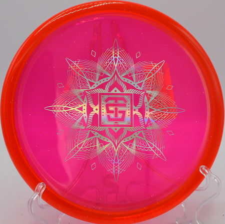 VEX Vessel TSA disc hyzering softly into the basket at Kensington Toboggan Disc Golf Course in Milford, Michigan.