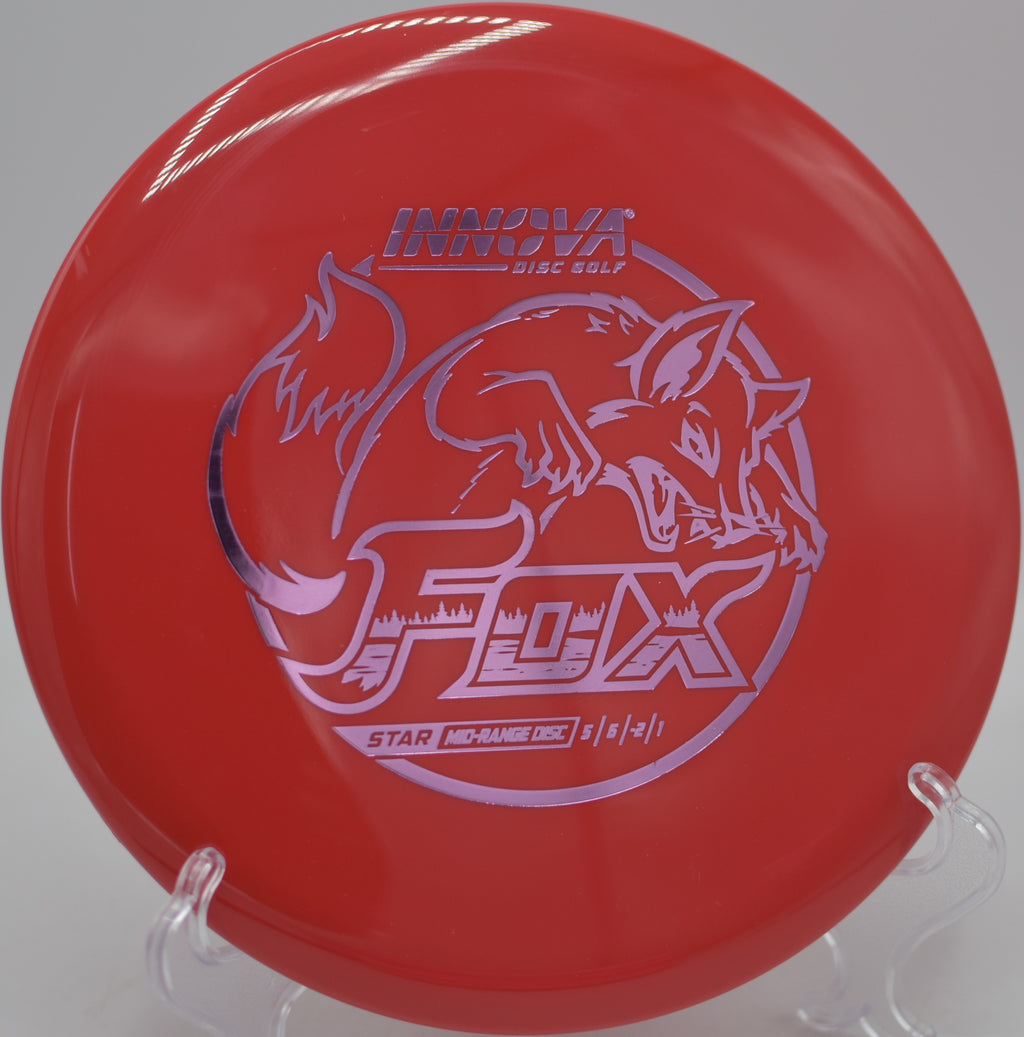 Innova Star Fox caught mid-flight during a hyzer-flip turnover at Milo McIver State Park Disc Golf Course in Estacada, Oregon.