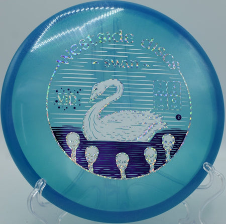 Westside Discs VIP Glimmer Swan putter parked under basket chains after a smooth circle-1 putt at Riverside Park Disc Golf Course in Evansville, Indiana