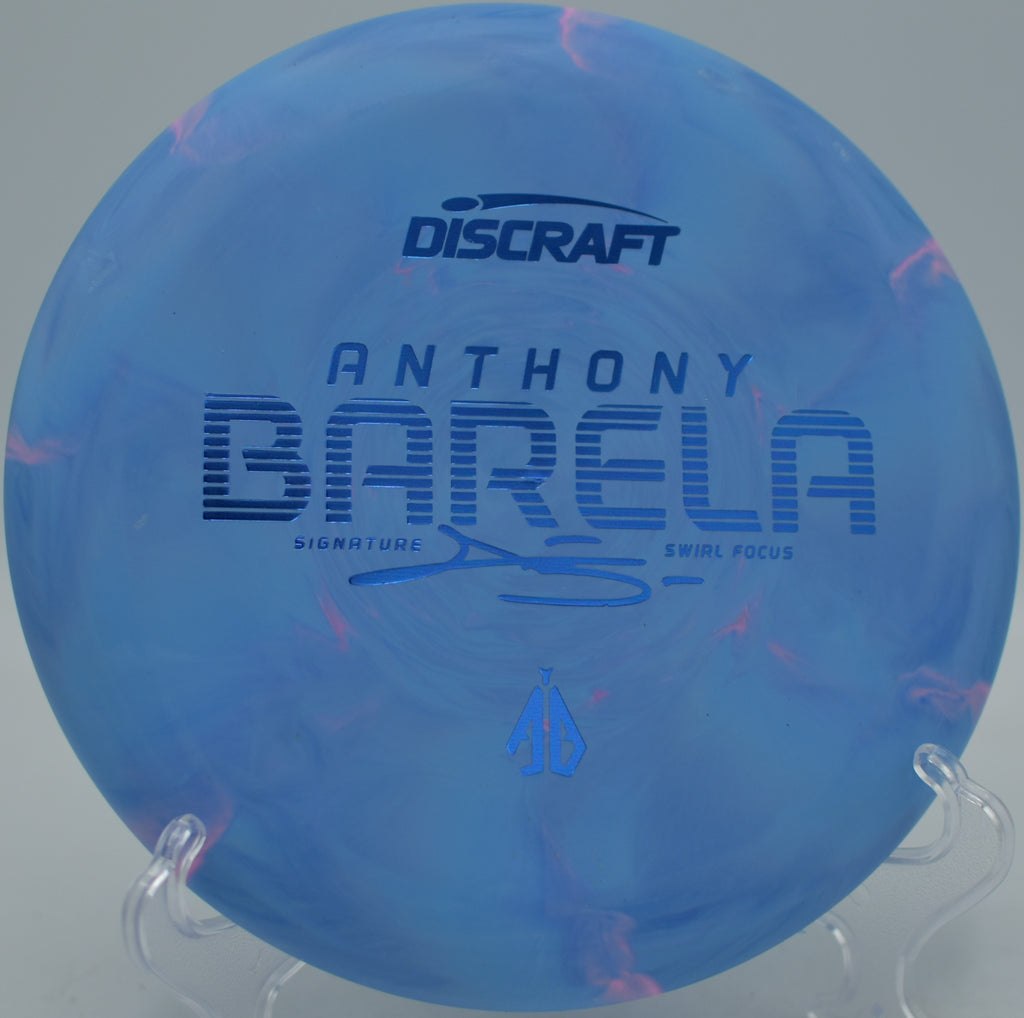 Discraft CT Swirl Focus Anthony Barela Tour Series gliding on a soft approach at Creekside Disc Golf Course in Salt Lake City, Utah.