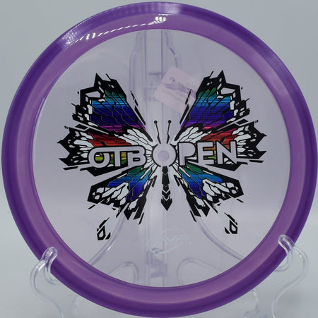 MVP Insanity Soft Prism Proton long turnover carry at Caliber Disc Golf Course in Sandpoint, Idaho