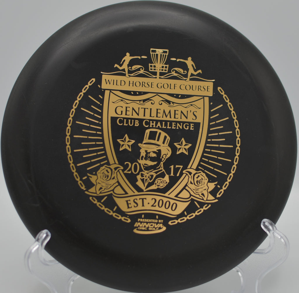 Black DX Aviar hyzer-putted into the cage at Kit Carson Park Disc Golf Course in Escondido, California.