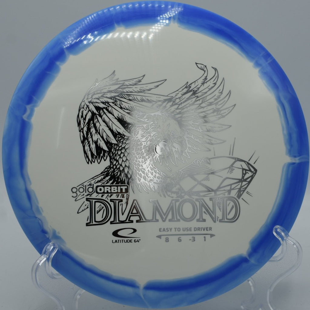 Latitude 64 Gold Orbit Diamond driver lying on pine needles at Harmon Hills Disc Golf Course in Fall Branch, Tennessee