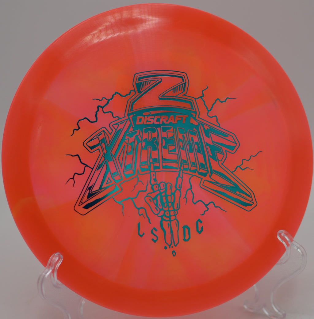 Discraft Xtreme Ledgestone Edition flying flat and controlled with heavy fade at Morley Field Disc Golf Course in San Diego, California.