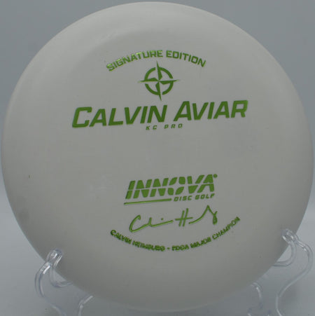 Calvin KC Pro Aviar putter parked under basket chains after a confident circle-1 putt at Winthrop University Disc Golf Course in Rock Hill, South Carolina