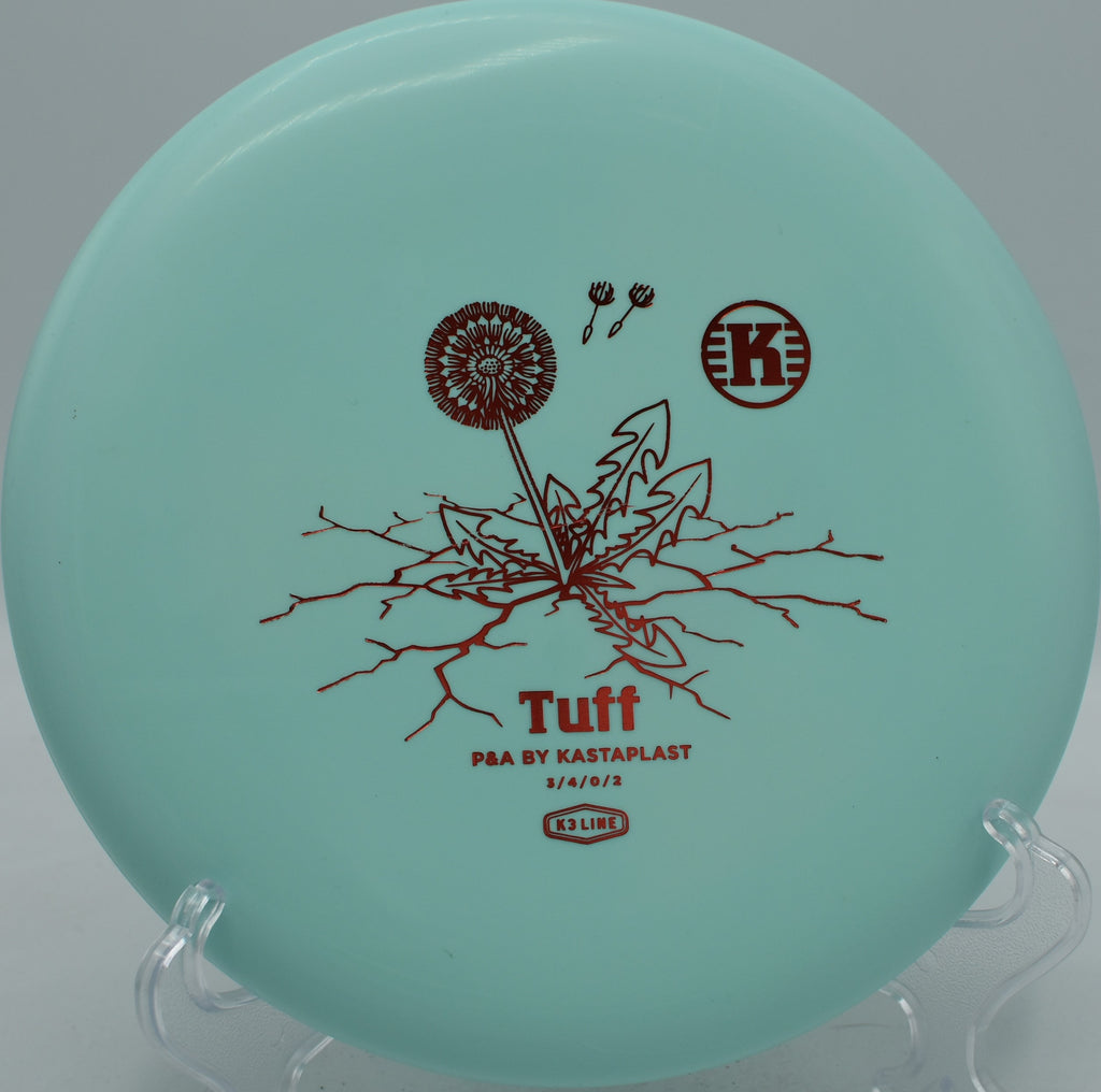 K3 Tuff First Run Kastaplast putter gliding flat with a soft finish at Moraine State Park Disc Golf Course in Portersville, Pennsylvania.